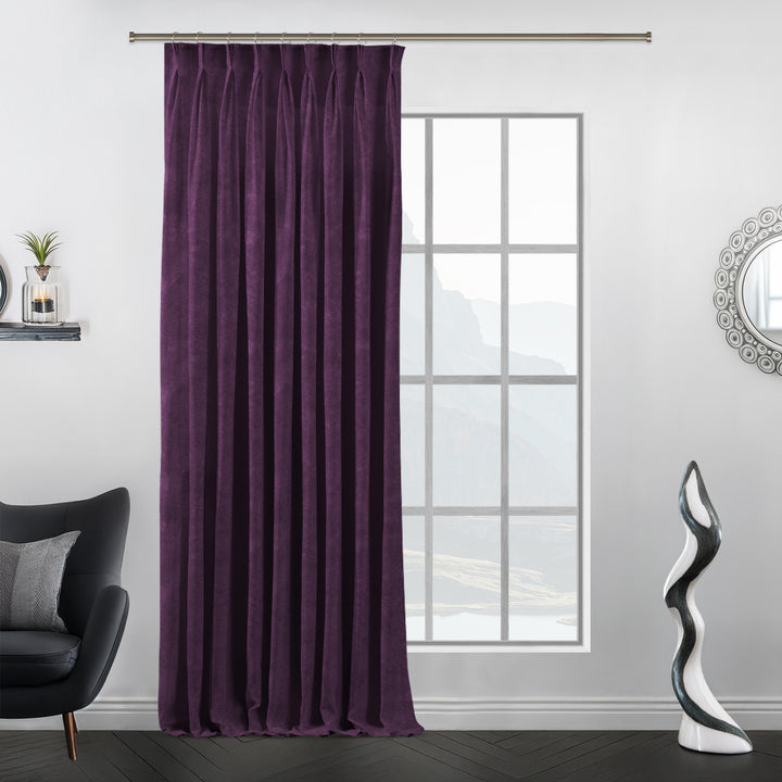 Plum velvet pinch pleat curtain, custom‑made with structured folds and extra‑long drop.