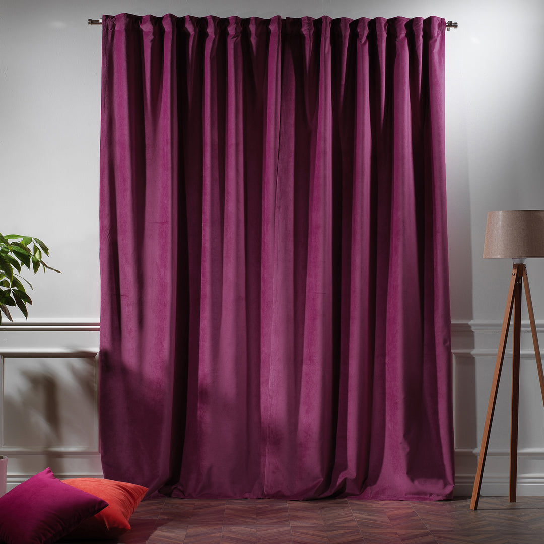 Bright pink velvet curtain panel tailored to size, offering full‑length coverage and bold magenta tone.
