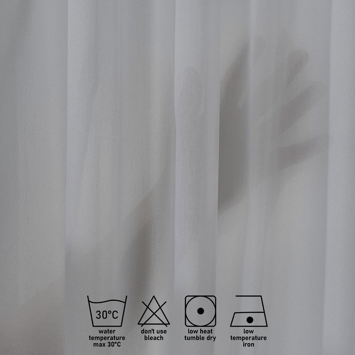 Made‑to‑measure extra‑long and extra‑wide grey chiffon semi‑sheer curtain with smooth woven texture, gentle light diffusion and a refined soft drape.