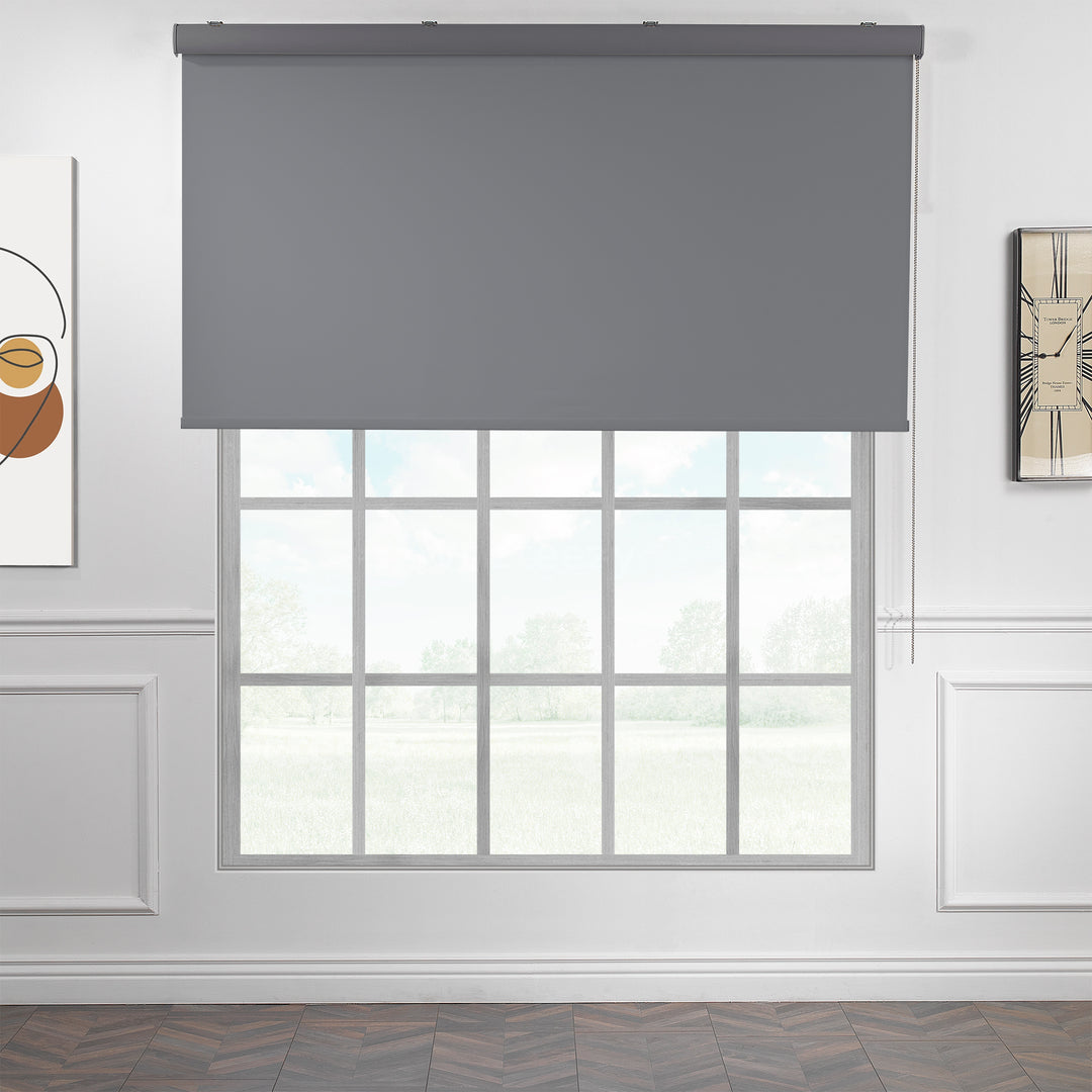 A made to measure grey room darkening roller blind featuring a smooth matte finish and refined edges offering balanced dimming