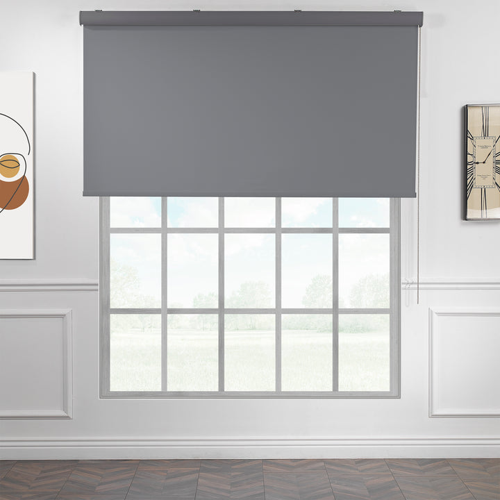 A made to measure grey room darkening roller blind featuring a smooth matte finish and refined edges offering balanced dimming