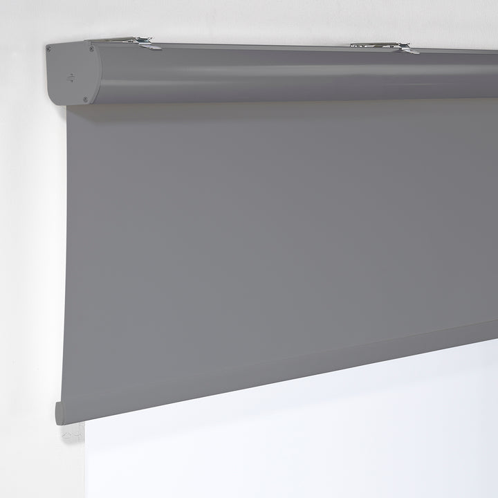 A grey room darkening roller blind made to measure, photographed with a soft matte texture and tidy straight lines providing gentle light reduction