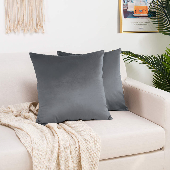 A made to measure cushion cover in soft grey shiny velvet, shown with a subtle reflective sheen and neatly tailored edges for a clean modern finish