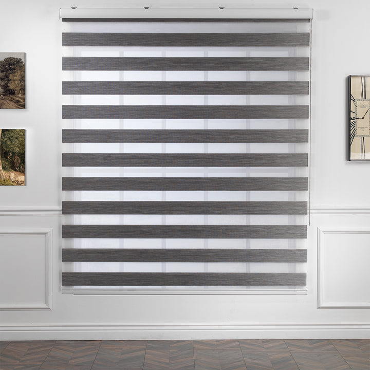 Made to measure zebra roller blind in grey, designed with alternating sheer and opaque horizontal stripes for adjustable light control and privacy, highlighting the bold black tone, smooth texture and modern day‑and‑night blind style.