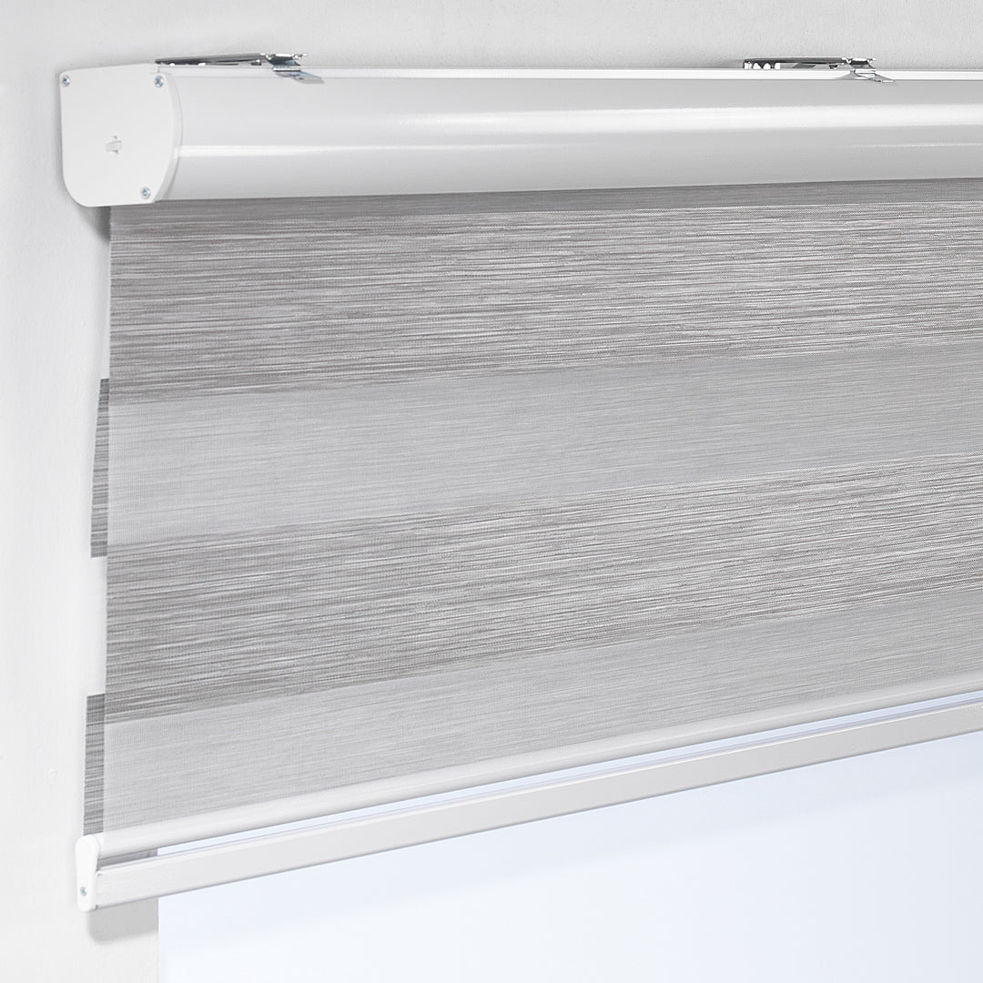 Made to measure striped roller blind in silver grey , designed with alternating sheer and opaque horizontal stripes for adjustable light control and privacy, highlighting the bold black tone, smooth texture and modern day‑and‑night blind style.