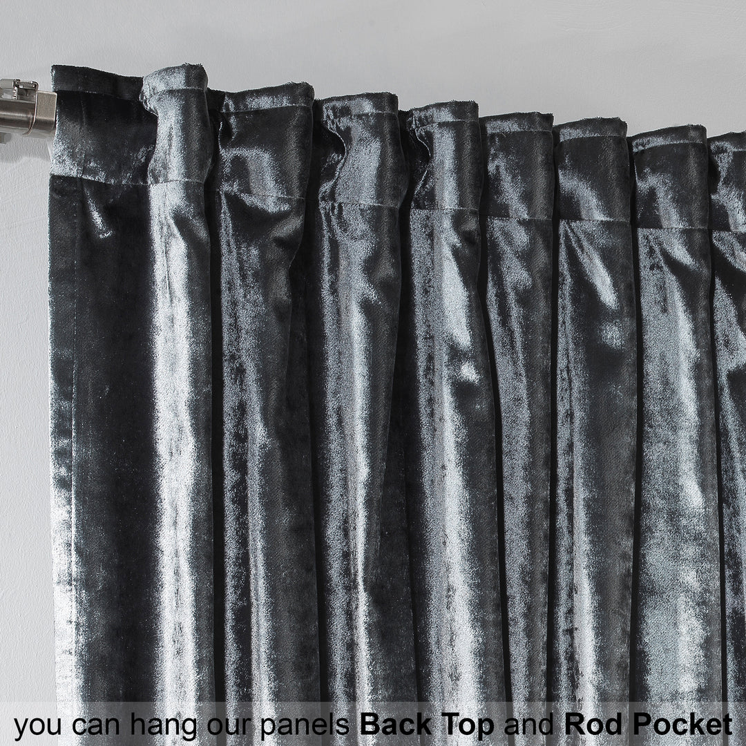 Close‑up of grey shiny velvet fabric showing reflective sheen, smooth surface and soft flowing texture