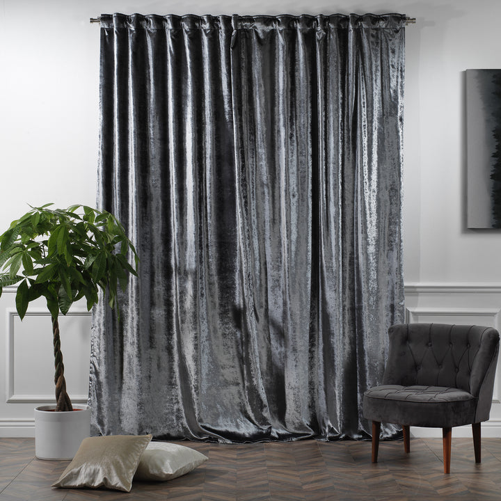 Full‑length shiny velvet curtain panel with smooth glossy texture and refined tailored look.