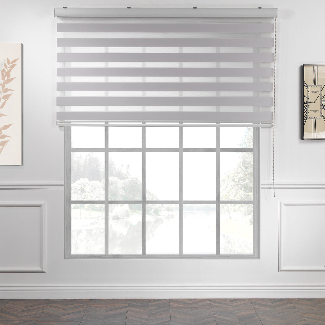 Made to measure solid silver zebra roller blind featuring subtle metallic‑toned alternating sheer and dim‑out stripes for sleek, adjustable light control and privacy, highlighting its light‑reflecting silver shade, smooth woven texture and contemporary day‑and‑night blind design.