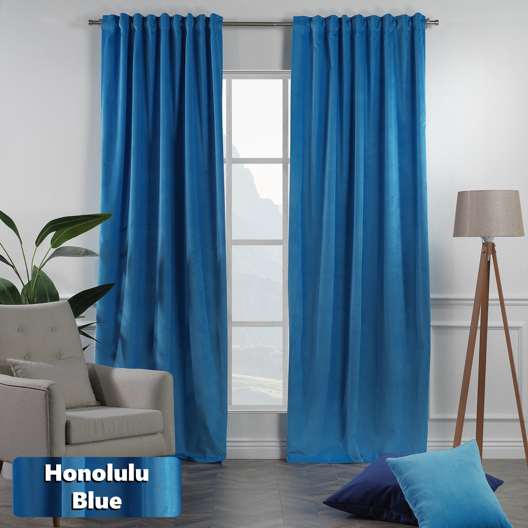Matte velvet eyelet curtain with smooth ring‑top movement and a long, fluid drape.