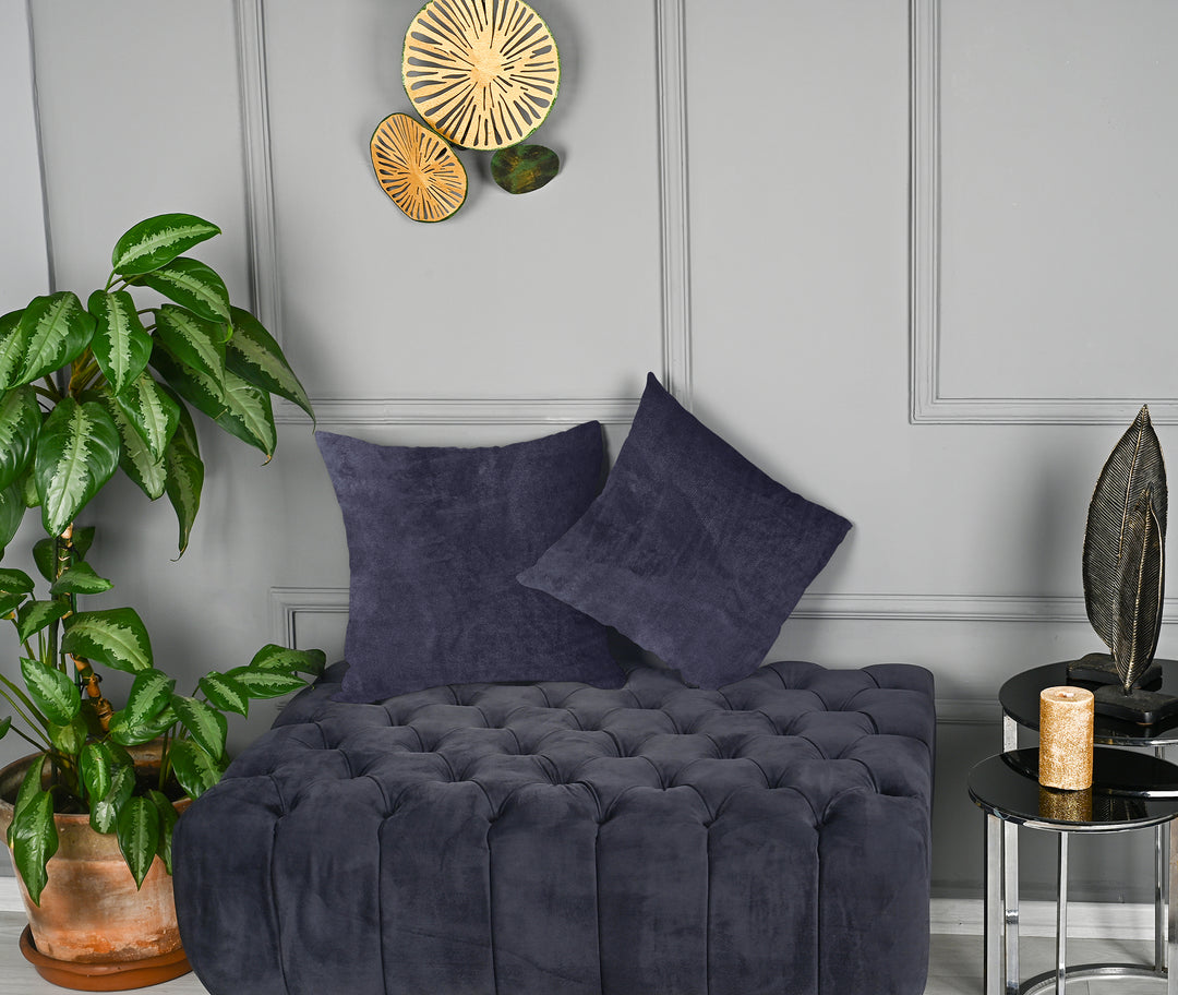 A made to measure cushion cover in deep muted blue‑grey matte velvet, shown with a smooth plush texture and refined edges for a sophisticated modern look