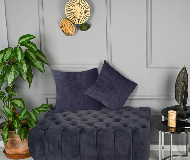 A made to measure cushion cover in deep muted blue‑grey matte velvet, shown with a smooth plush texture and refined edges for a sophisticated modern look