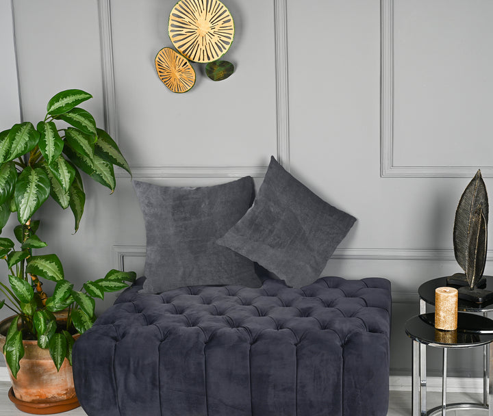 A made to measure cushion cover in cool iron‑grey matte velvet, shown with a smooth plush texture and clean structured edges for a sleek modern appearance