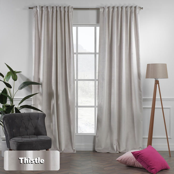 Eyelet header detail on thistle matte velvet curtain, clean ring finish and smooth matte texture.