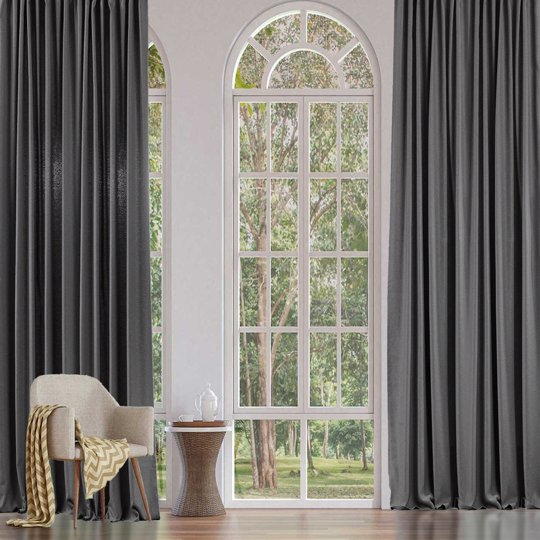 An extra‑long wide linen‑look door curtain in light grey, showing smooth tailored folds, airy daylight texture and a refined finish