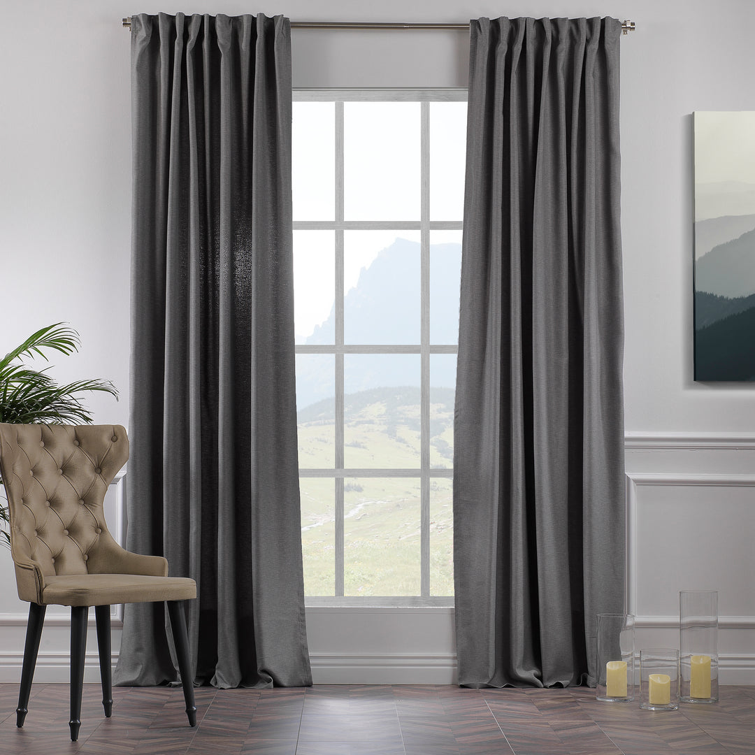 A made to measure linen‑look curtain in light grey, photographed in daylight with subtle weave and a clean soft drape