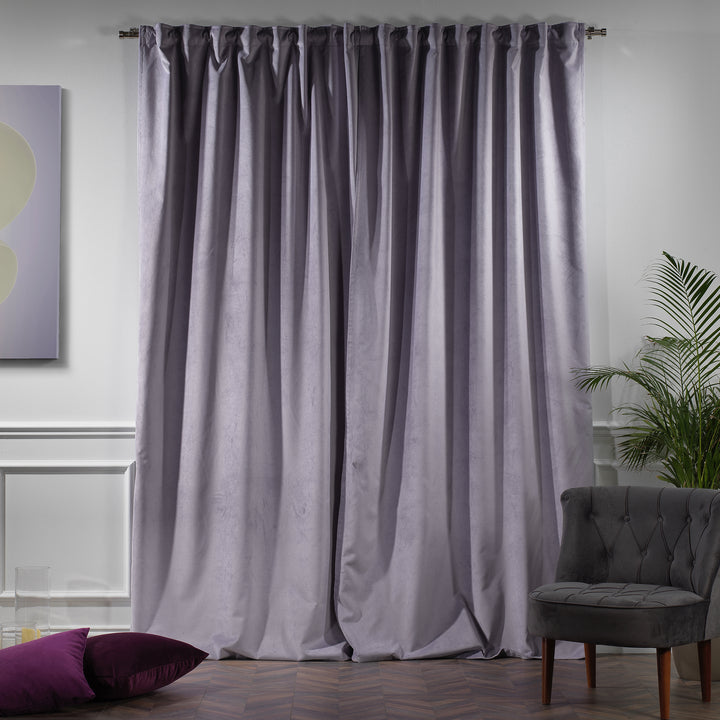 Extra‑long extra‑wide lavender matte velvet curtain hanging on window, smooth matte finish, luxury tailored look.