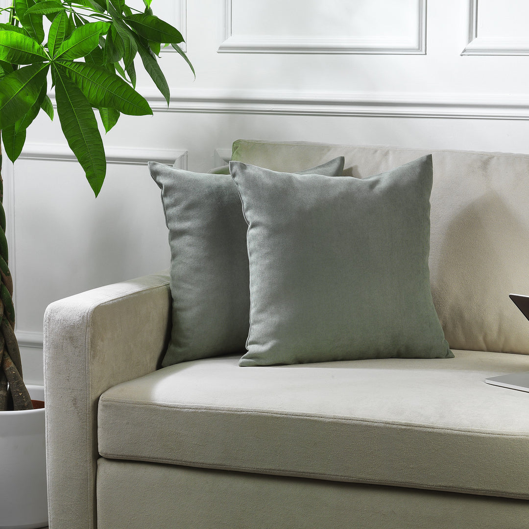 A made to measure cushion cover in fresh leaf‑green velour, shown with a smooth plush texture and clean edges for a lively decorative finish