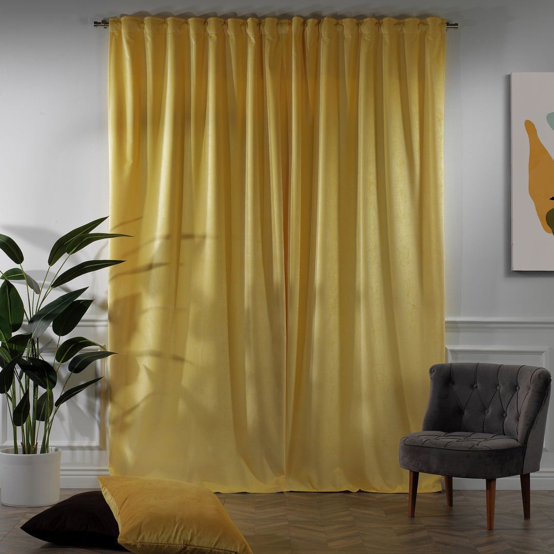 Warm yellow velvet curtain panel offering full‑length drape and gentle colour.