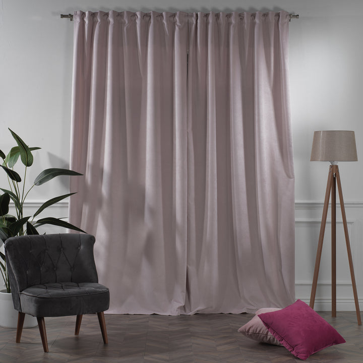 Extra‑long extra‑wide light pink matte velvet curtain hanging on window, smooth matte finish, luxury tailored look.