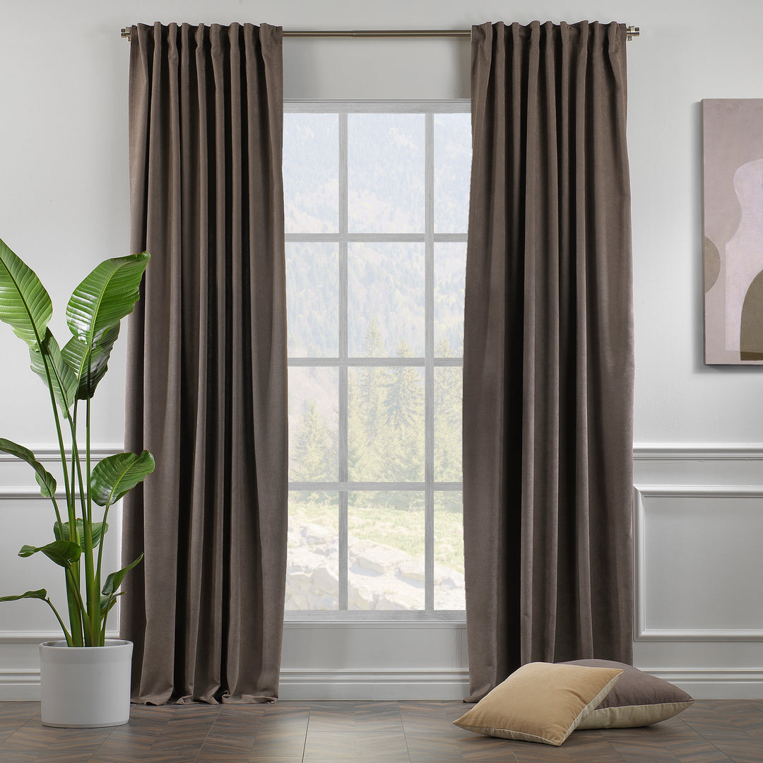 Light brown velour curtains shown in daylight, highlighting smooth pile texture and natural warm colour.