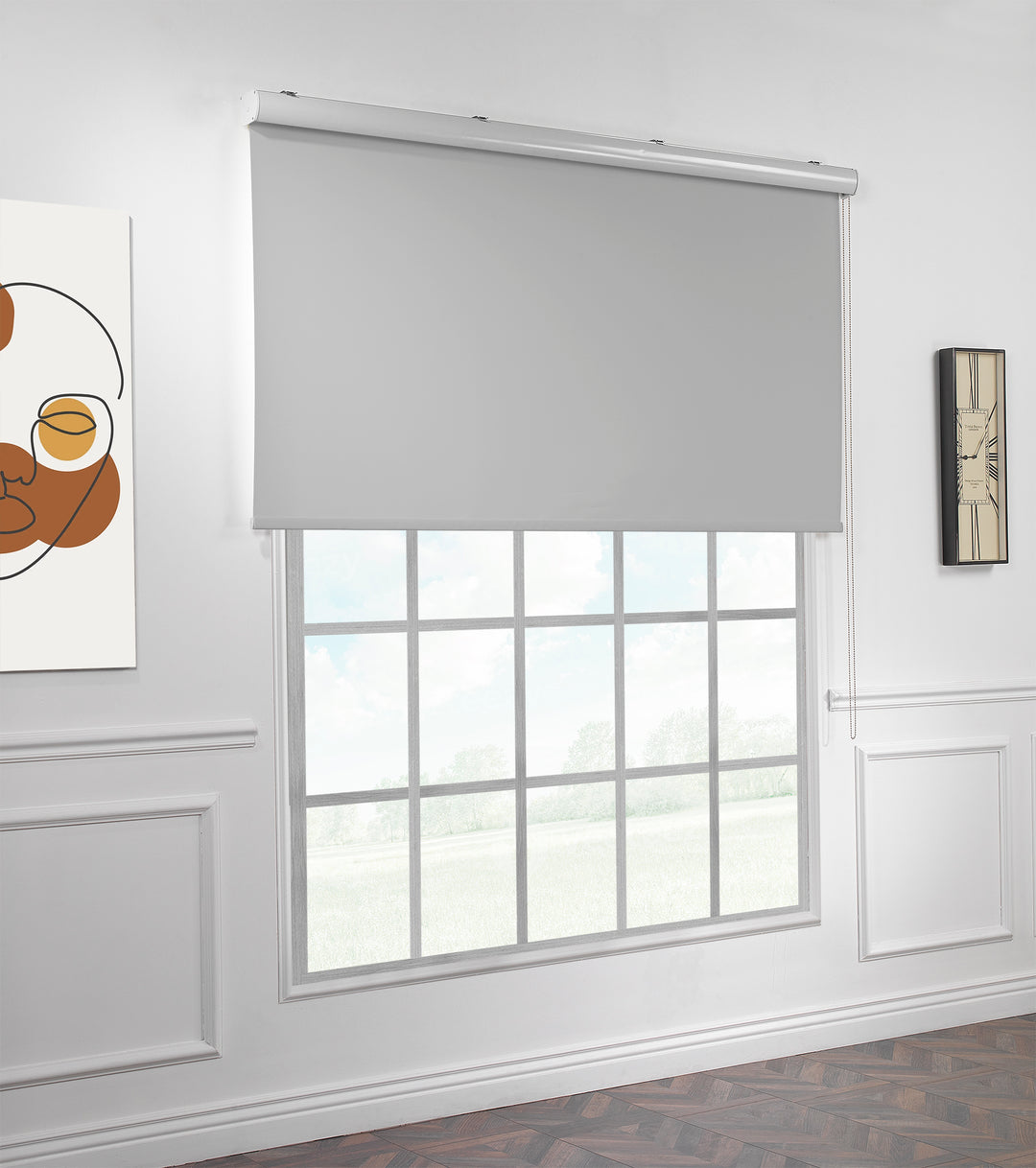 A made to measure light grey room darkening roller blind shown lowered with a smooth matte texture and clean minimal edges
