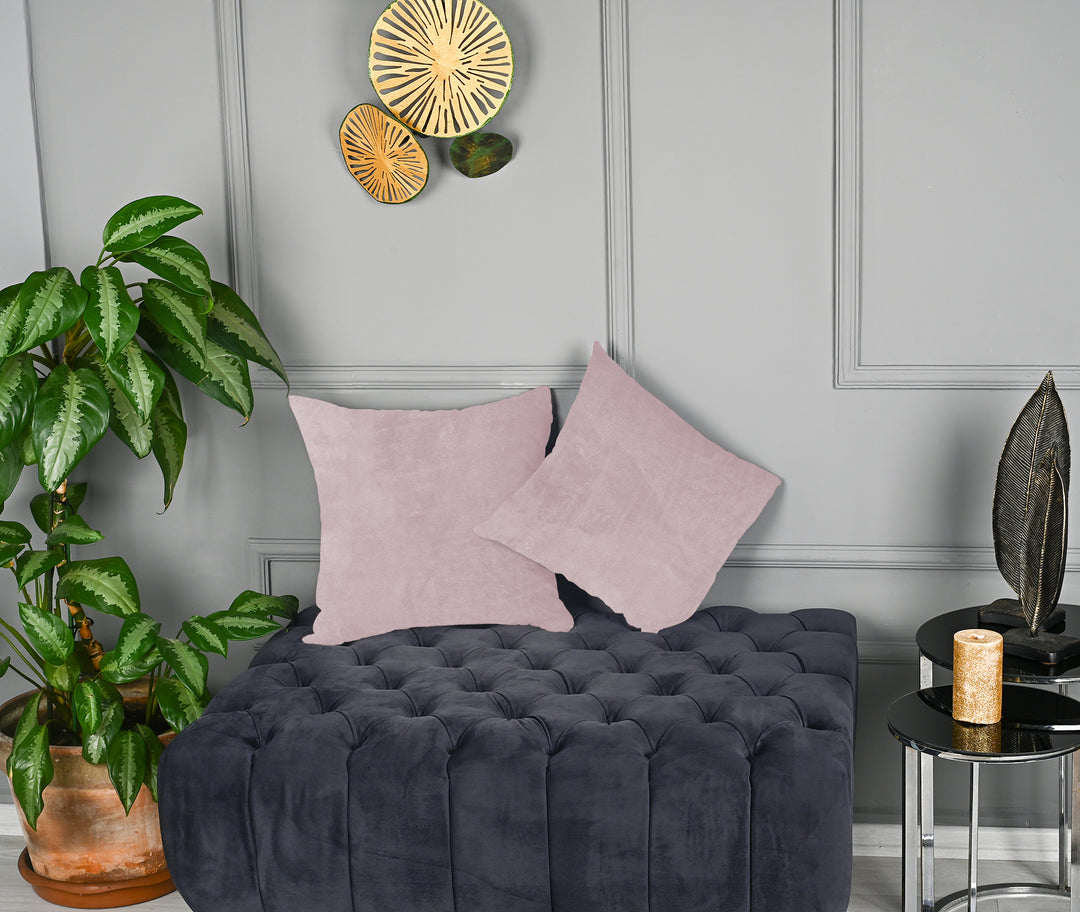 A made to measure cushion cover in pale blush matte velvet, displaying a soft velvety surface and clean seams for a delicate refined finish