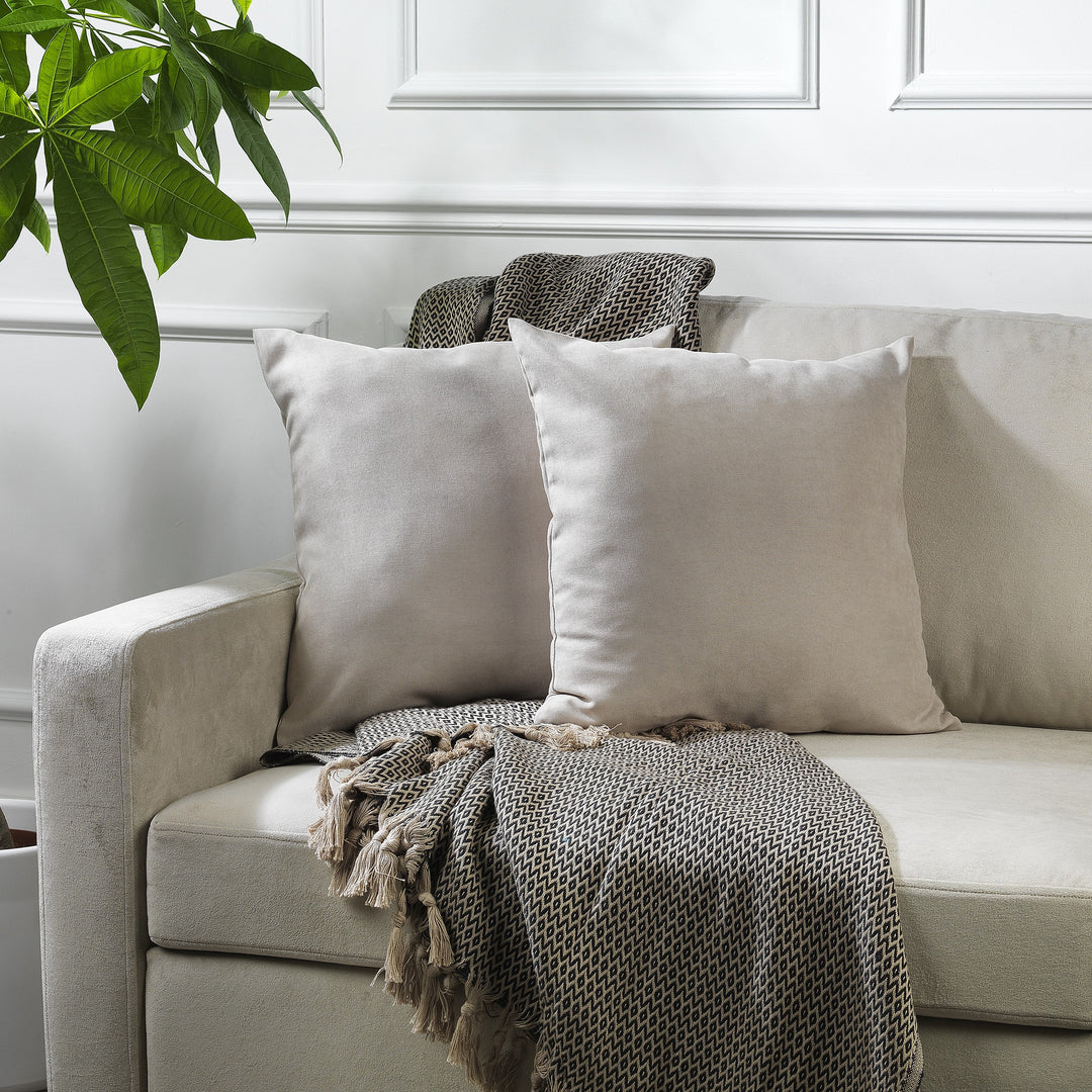 A made to measure cushion cover in soft stone velour, shown with a lightweight plush texture and neatly tailored edges for a refined decorative finish