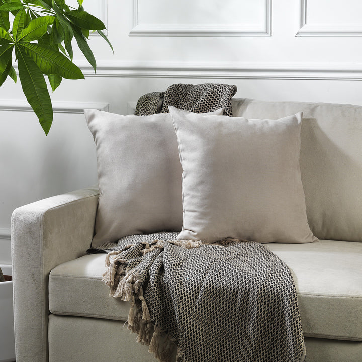 A made to measure cushion cover in soft stone velour, shown with a lightweight plush texture and neatly tailored edges for a refined decorative finish