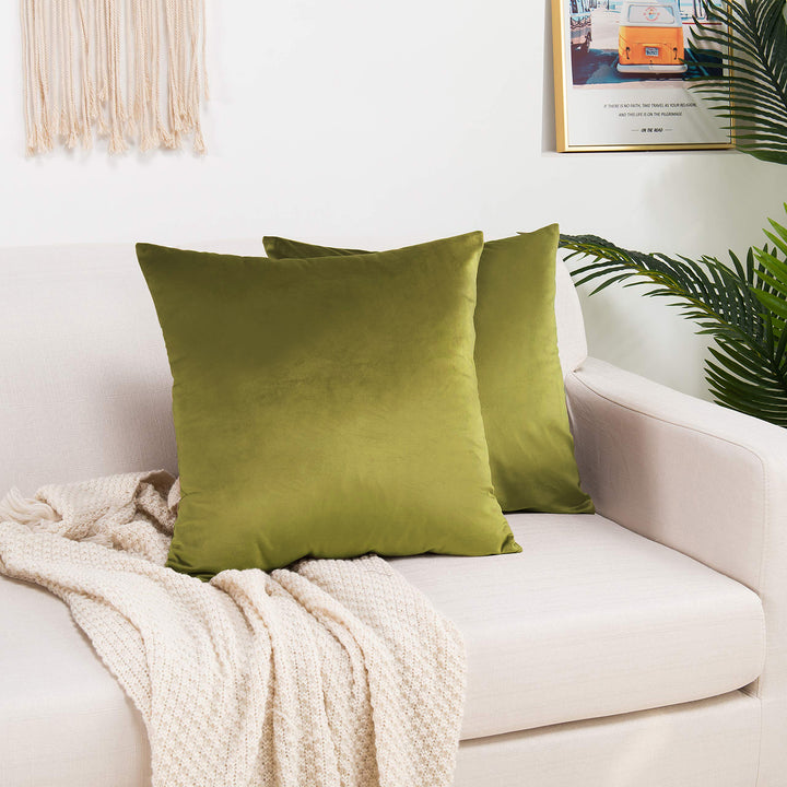 A made to measure cushion cover in bright lime‑green shiny velvet, featuring a smooth glossy surface and clean refined seams for a bold modern look