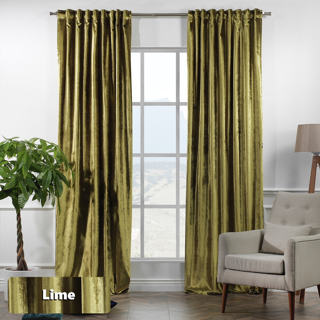Shiny velvet eyelet curtain with reflective sheen and smooth ring‑top movement in a long elegant fall.