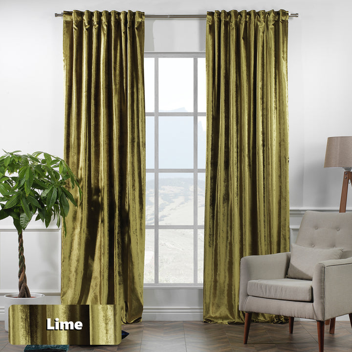 Shiny velvet eyelet curtain with reflective sheen and smooth ring‑top movement in a long elegant fall.