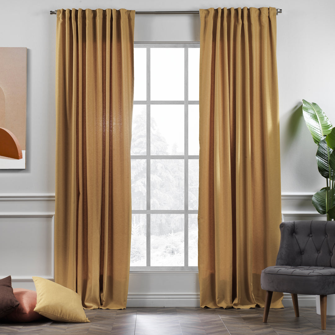 A made to measure linen‑look curtain in mustard yellow, photographed in daylight with warm woven texture and a soft natural drape

