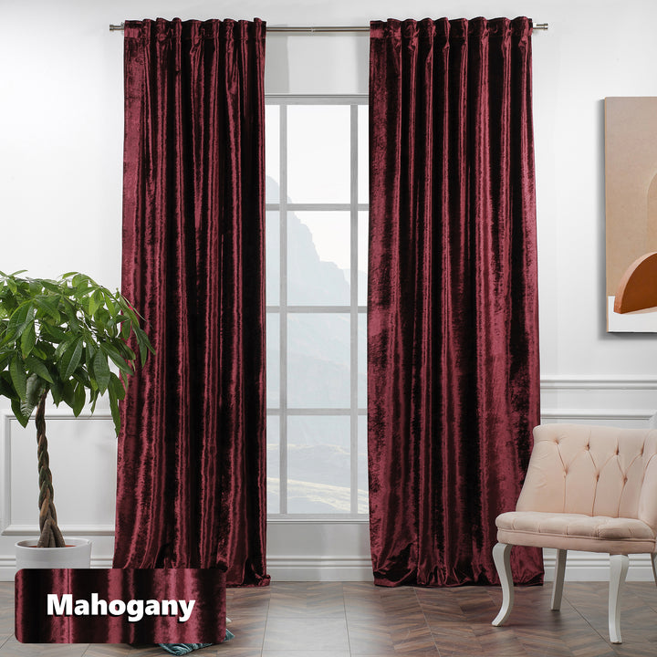 Extra‑long shiny velvet eyelet curtain with polished texture and contemporary metal ring header.