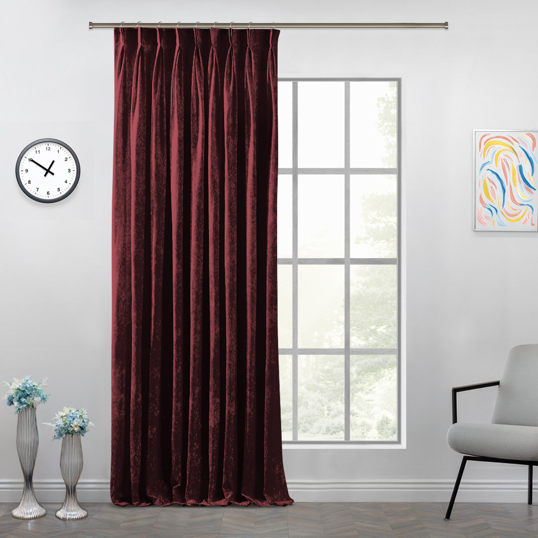 Custom shiny velvet pinch pleat curtain featuring sculpted folds and a polished, light‑catching surface.