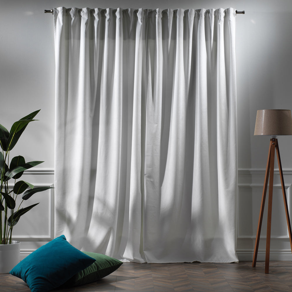 Made to measure white matte velvet curtain featuring a soft smooth drape and muted velvety texture, offering gentle light reduction and a clean elegant look, highlighting its pure white tone and premium modern velvet finish