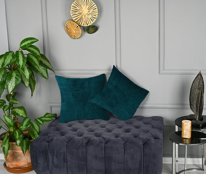 A made to measure cushion cover in dark forest‑green matte velvet, shown with a plush smooth texture and crisp seams for a bold elegant look