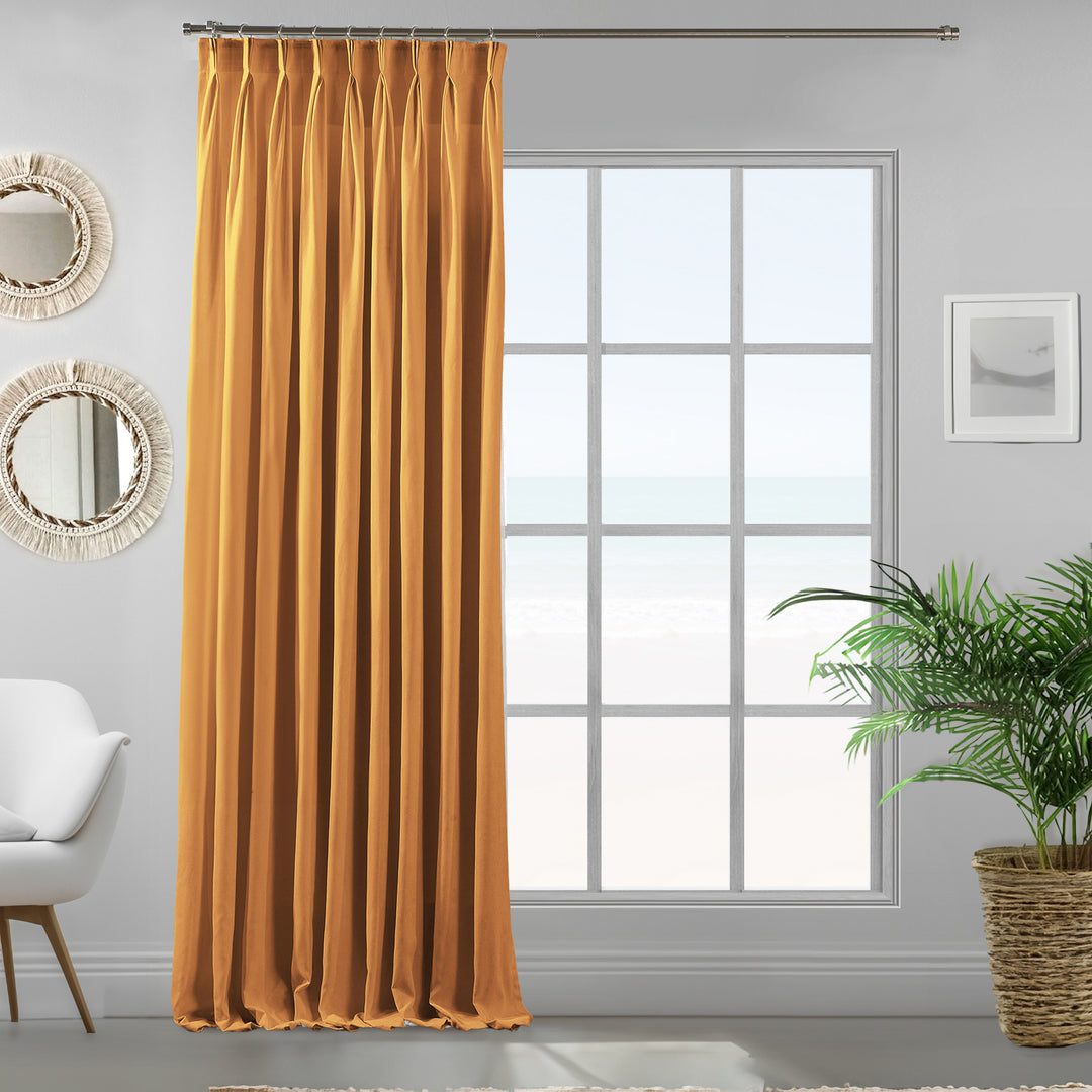 Single mustard yellow velour curtain panel showing soft drape and refined matte finish.