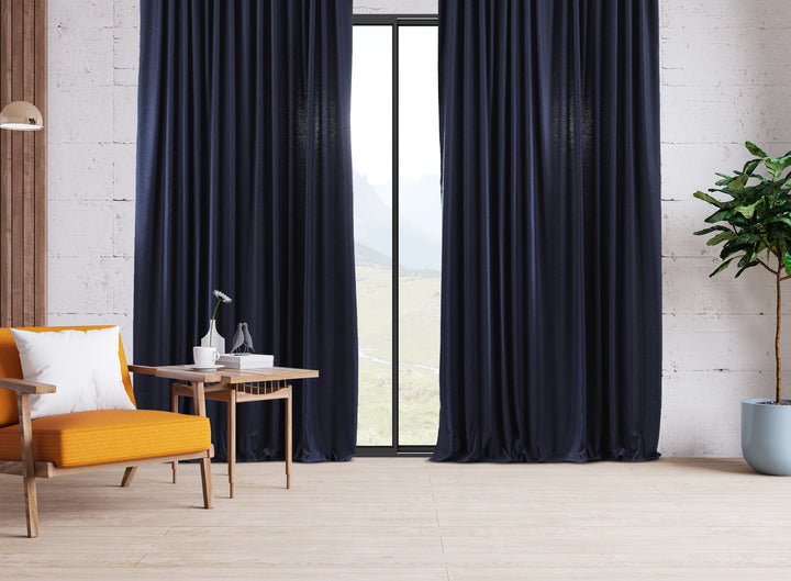 An extra‑long wide linen‑look door curtain in navy blue, showing smooth pleats, soft daylight depth and a premium tailored finish