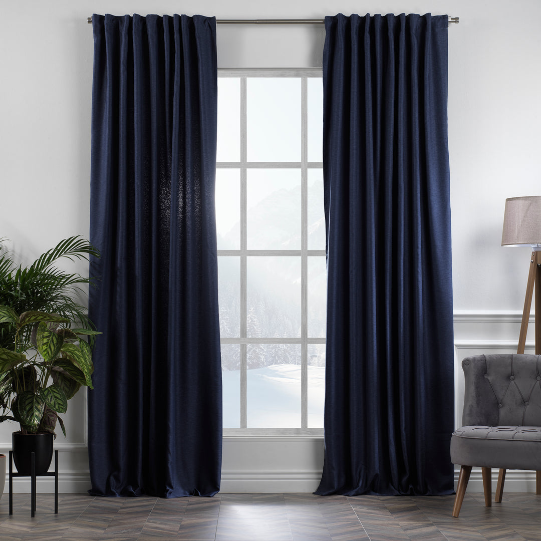 A made to measure linen‑look curtain in navy blue, displayed in daylight with subtle woven texture and a clean structured drape