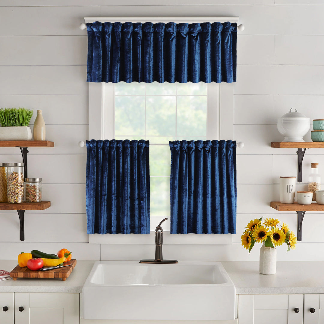 A made to measure valance in deep navy‑blue shiny velvet, featuring a reflective velvety surface and crisp seams for a rich premium appearance
