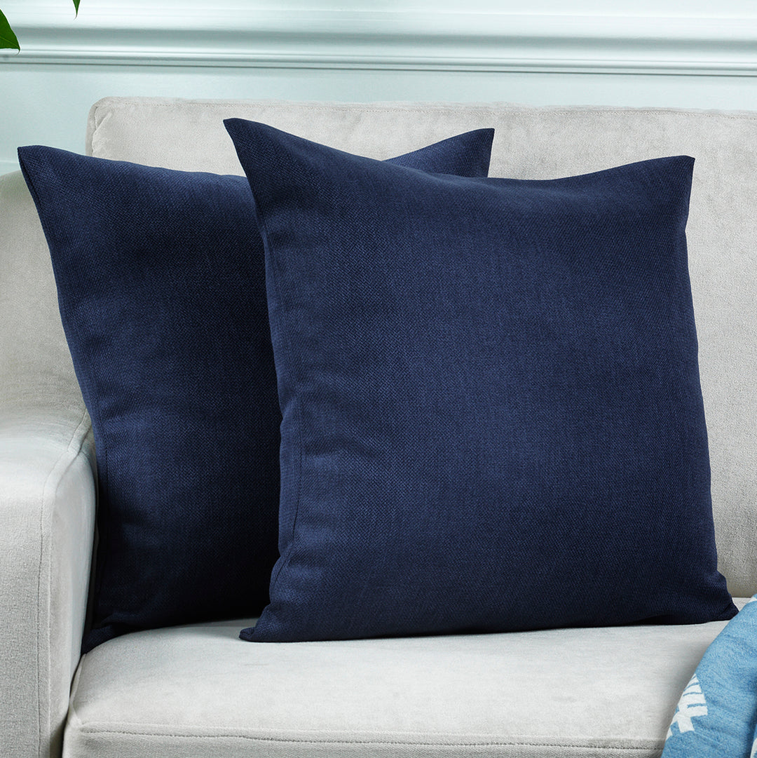 A made to measure cushion cover in deep navy linen‑look fabric, featuring a subtle woven texture and clean structured seams for a rich elegant appearance