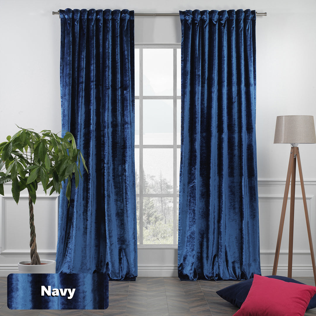 Navy blue shiny velvet eyelet curtain with easy‑glide rings and a sleek, light‑catching finish.