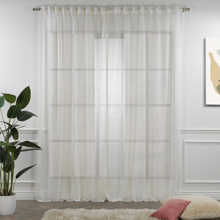 Off‑white linen sheer curtain fully closed in a neutral bright room, clean airy folds and natural semi‑sheer weave.