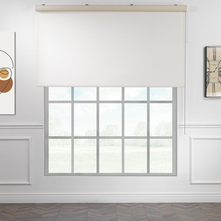 A made to measure off‑white room darkening roller blind shown with a soft matte surface and clean straight edges reducing incoming light
