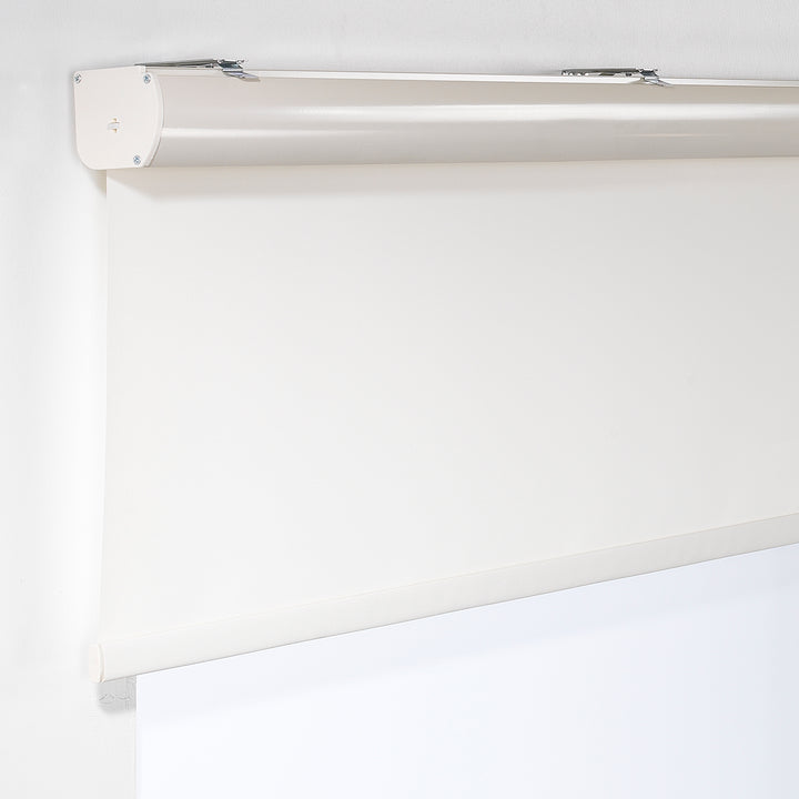 An off‑white room darkening roller blind made to measure, photographed with a smooth matte finish and refined minimal styling