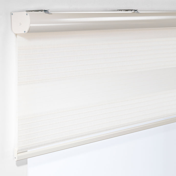 Made to measure off‑white thick pleated linen‑textured zebra roller blind featuring layered sheer and dim‑out stripes for soft diffused light control and privacy, highlighting its rich fabric texture, premium pleated finish and contemporary day‑and‑night blind design.