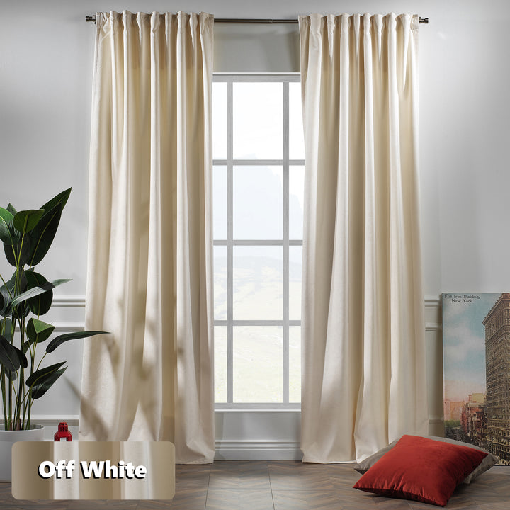 Off‑white matte velvet curtain featuring a soft smooth drape and muted velvety texture, offering gentle light reduction and a clean elegant look, highlighting its subtle off‑white tone and premium modern velvet finish.