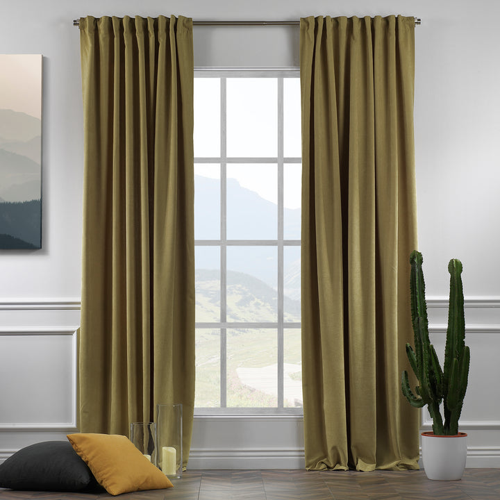 Olive green velour curtains shown in daylight, highlighting textured pile, warm undertone and elegant soft drape.