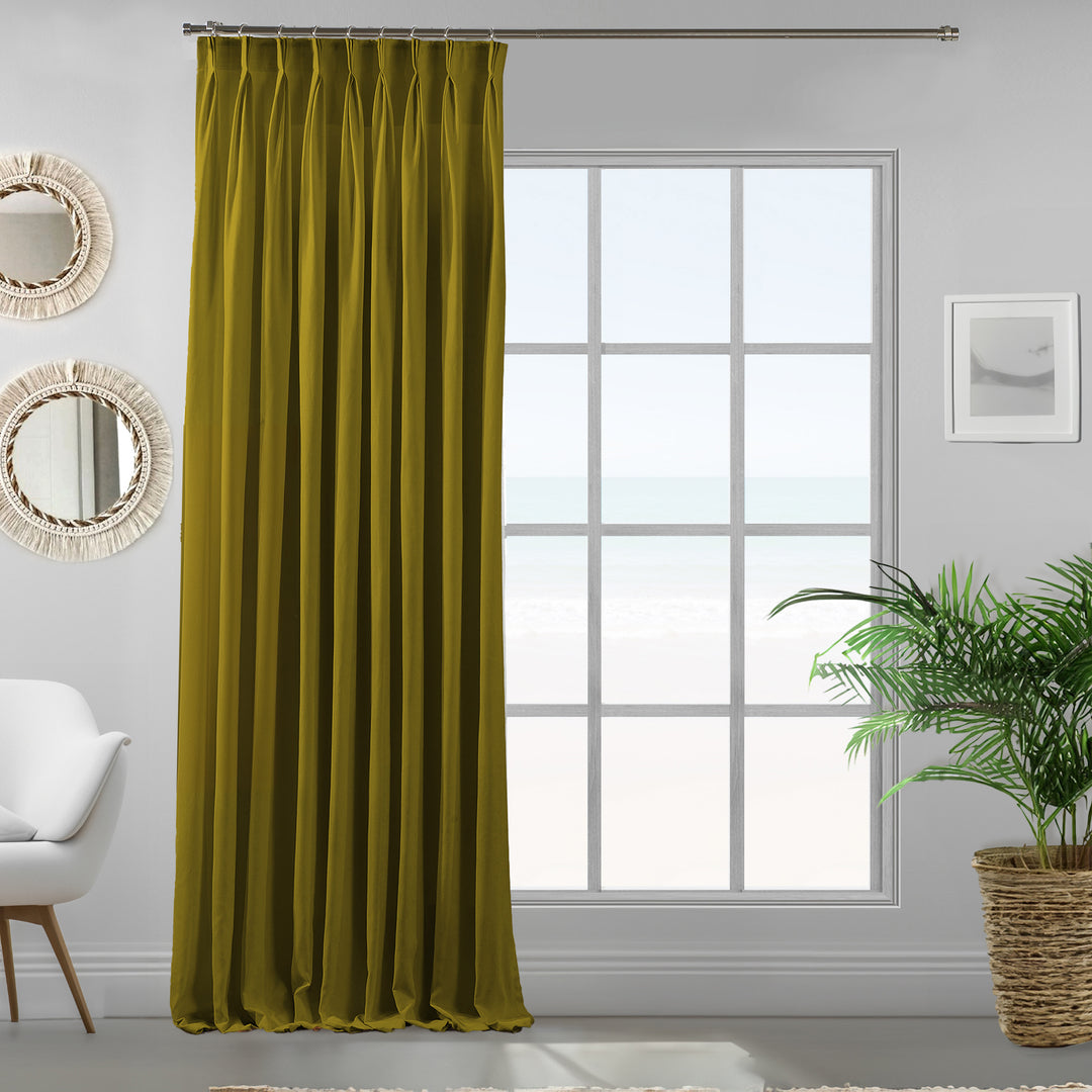 Single olive green velour curtain panel showing smooth pile texture and refined made‑to‑measure fall.