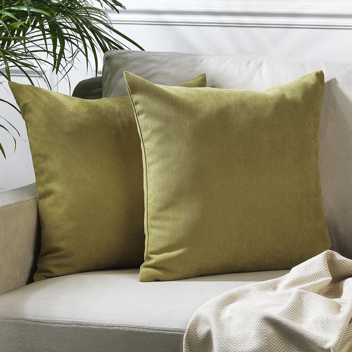 A made to measure cushion cover in warm olive velour, featuring a soft lightweight texture and neatly tailored seams for a refined earthy look